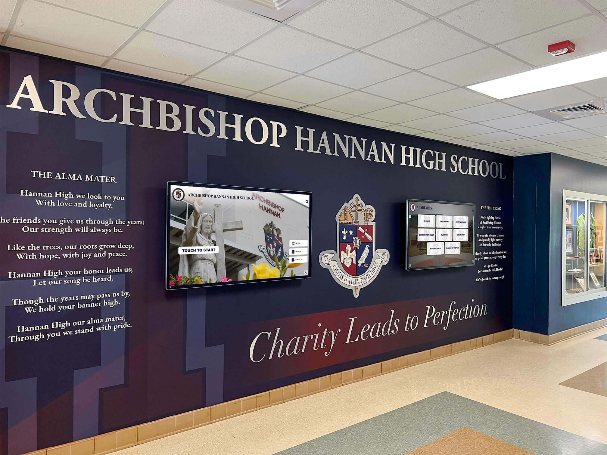 School lobby with historic murals and digital displays School lobby display