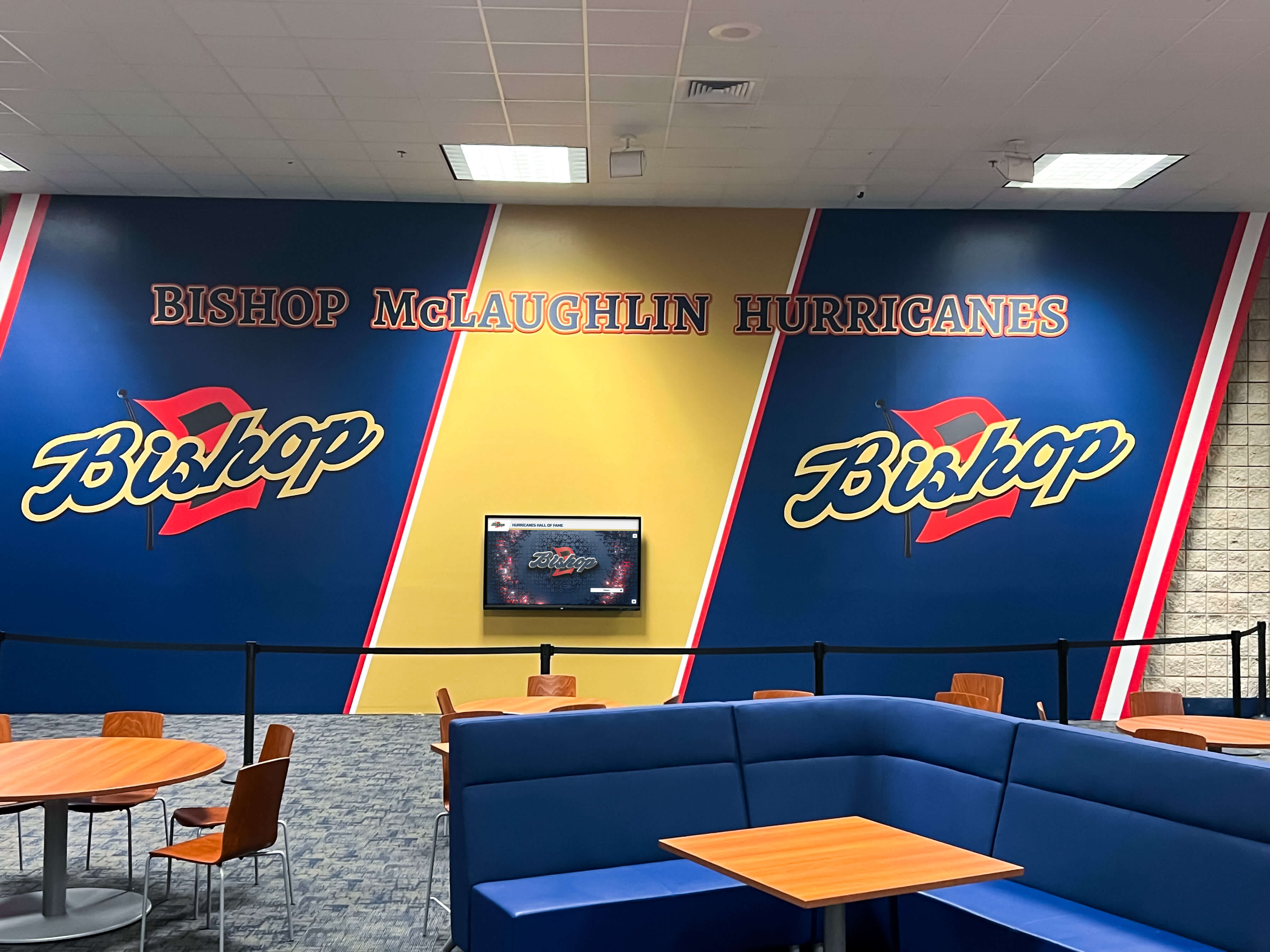 Cafeteria lounge with athletics mural