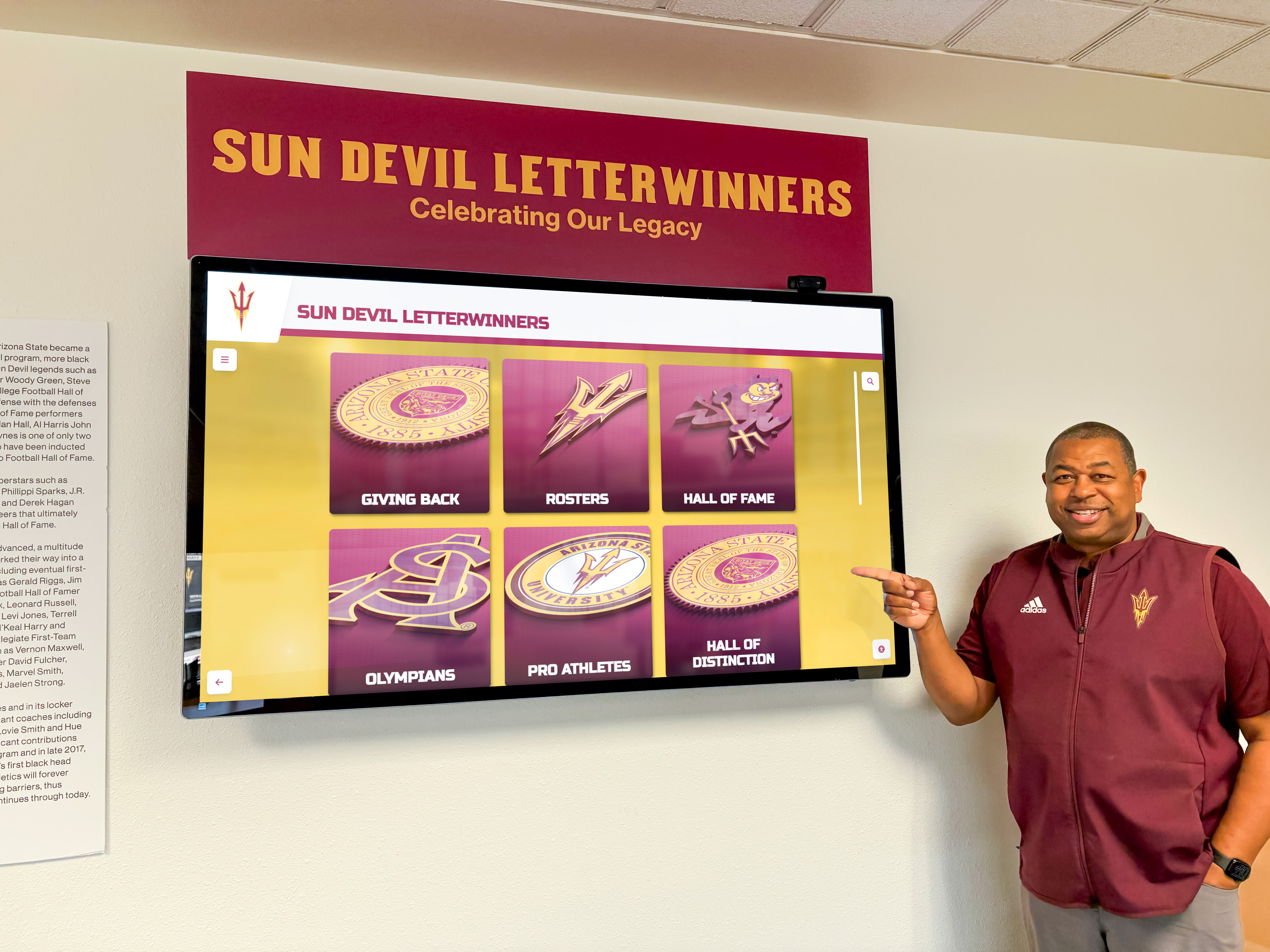 Team captain viewing letterwinners recognition display Team captain recognition display